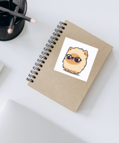 Cute Pomeranian puppy sticker printed on a notebook
